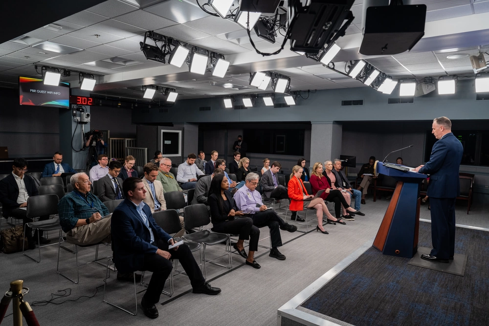 Military Reporters and Editors Pentagon press briefing with journalists in attendance.